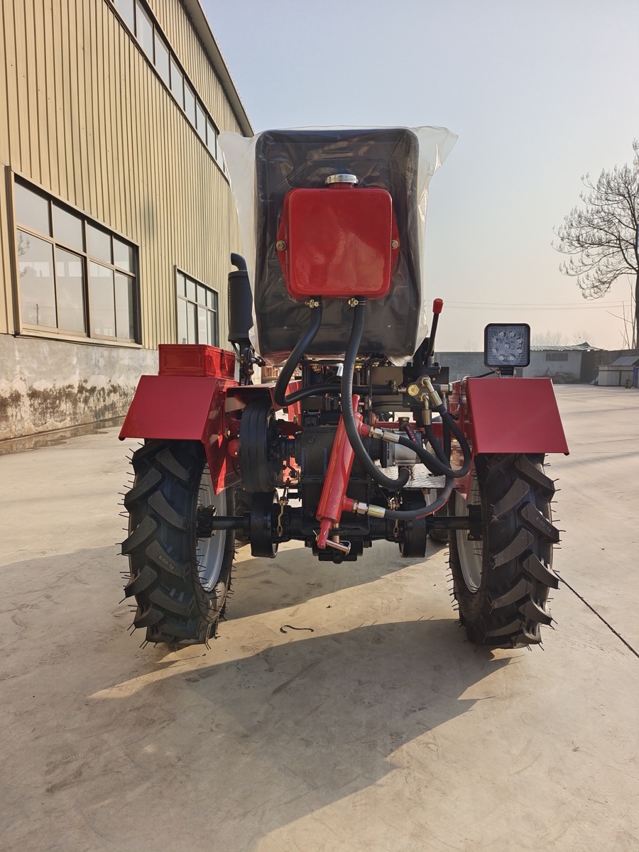Rear detail of a mini tractor showing hitch and hydraulic connection area